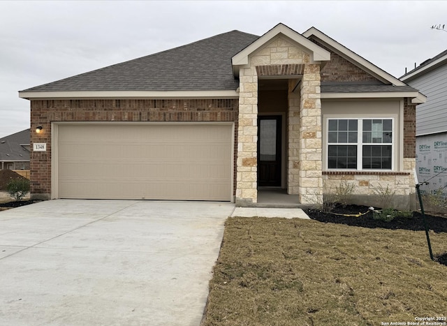 view of front of home with a front yard and a garage