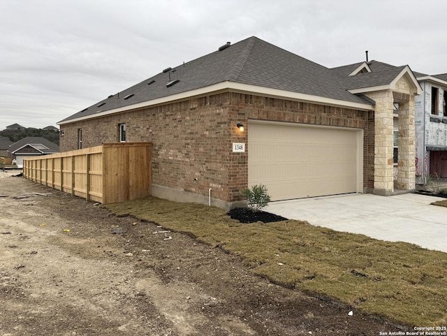 view of property exterior with a garage