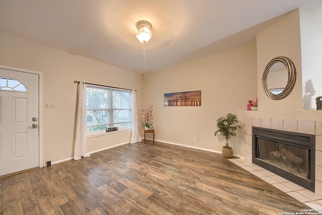 entryway with a fireplace and hardwood / wood-style floors