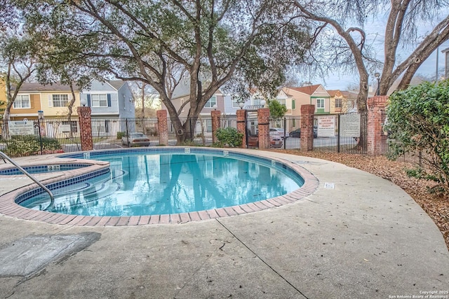 view of pool featuring a hot tub