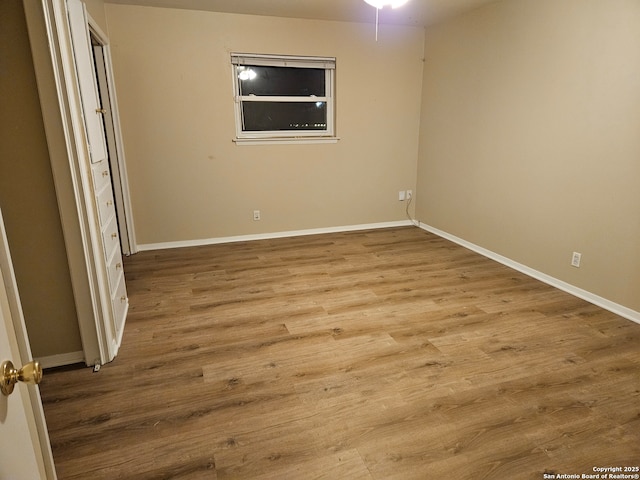 spare room with light wood-type flooring