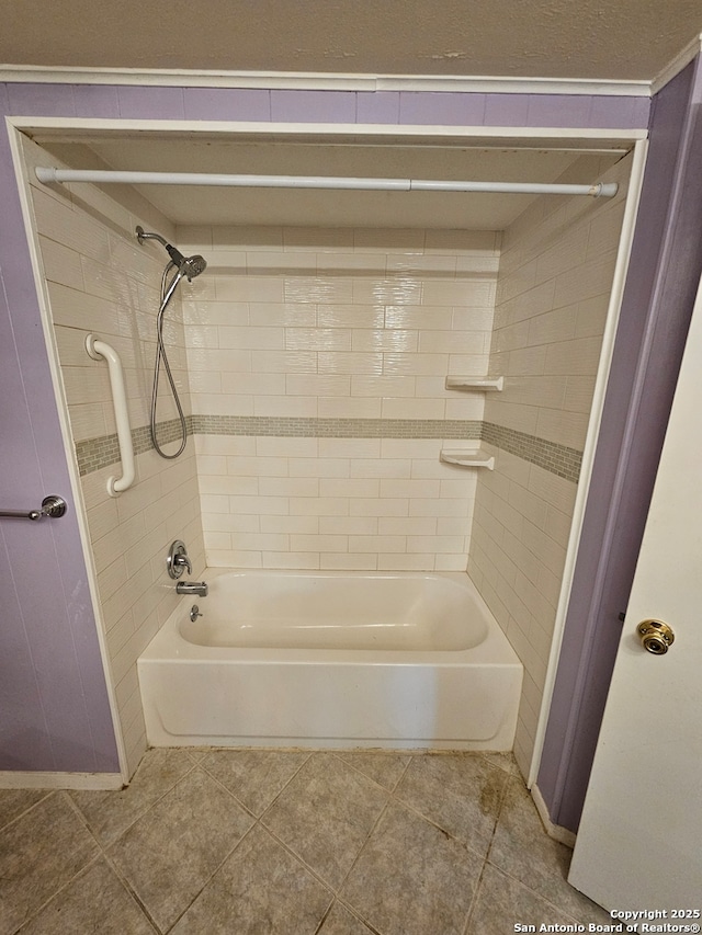 bathroom featuring tile patterned floors and tiled shower / bath combo