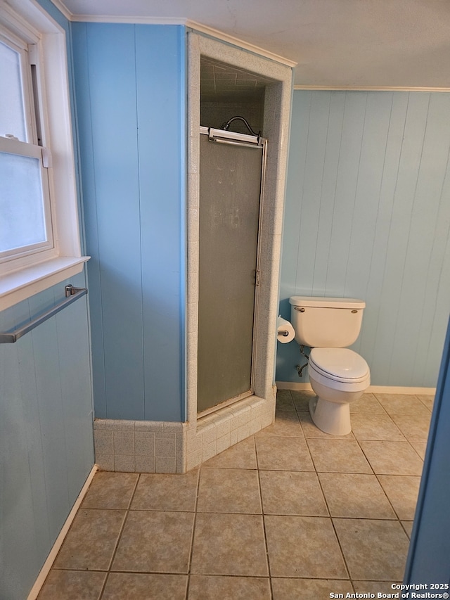 bathroom featuring tile patterned flooring, a wealth of natural light, and crown molding