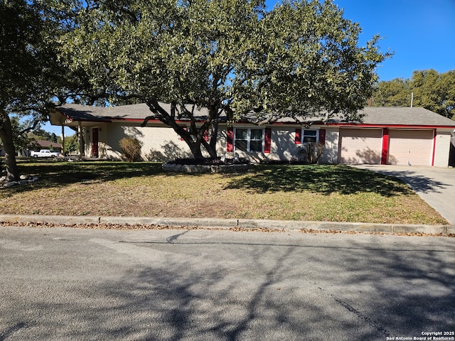 view of front of house with a garage and a front yard