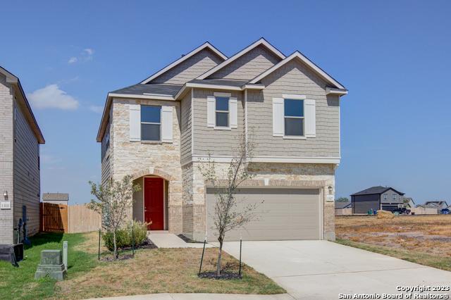 view of front of home with a garage