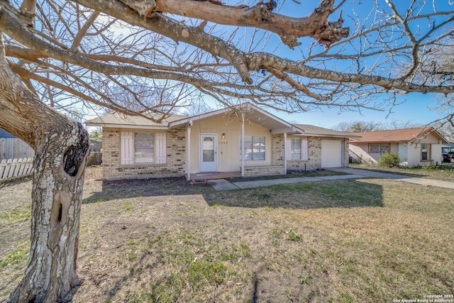 single story home with a garage and a front lawn