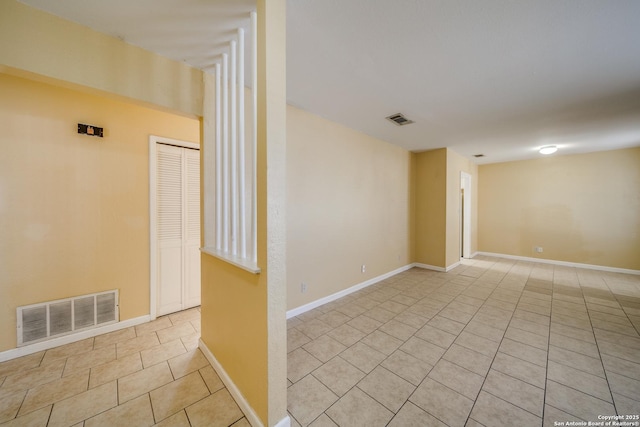 empty room with light tile patterned floors