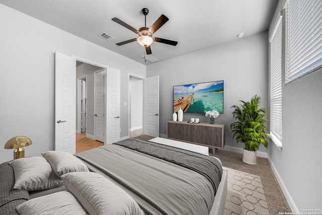 carpeted bedroom with ceiling fan