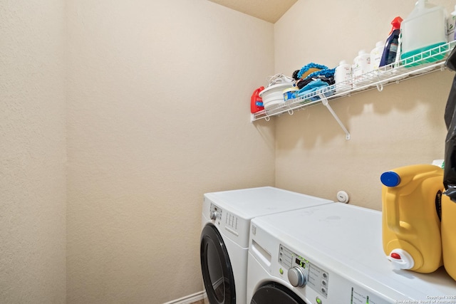 washroom featuring washing machine and dryer