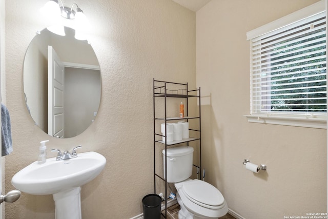 bathroom featuring toilet and sink