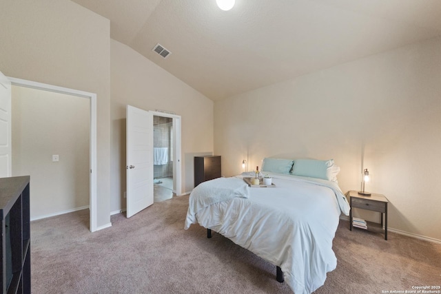 carpeted bedroom with lofted ceiling