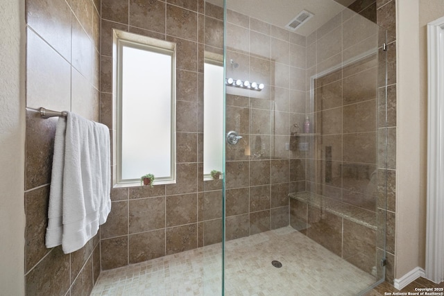 bathroom featuring tiled shower