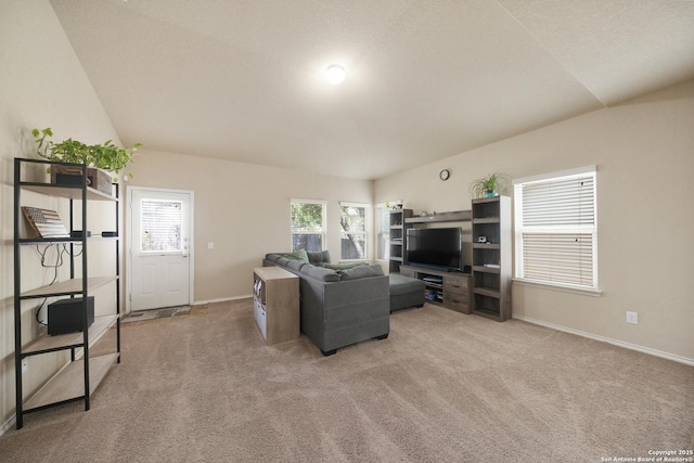 living room with a healthy amount of sunlight and light carpet