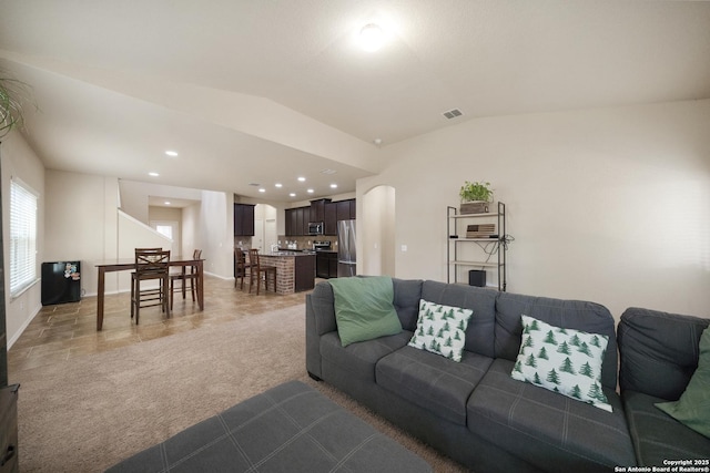 living room with carpet and lofted ceiling