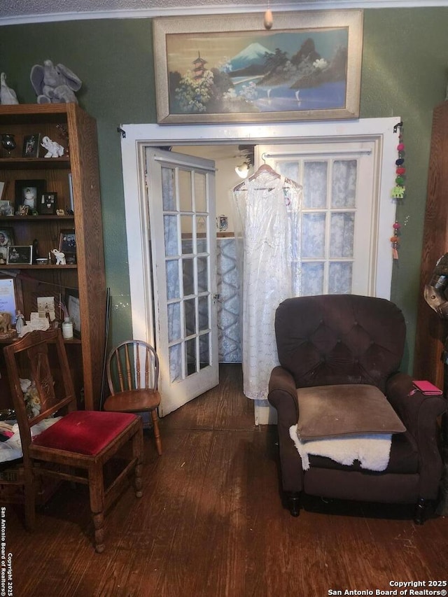 sitting room with hardwood / wood-style flooring