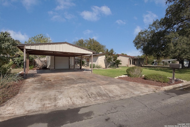 view of front of property with a front lawn and a carport