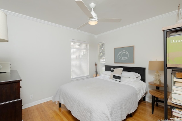 bedroom with ceiling fan, wood-type flooring, and crown molding