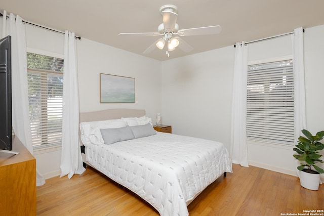 bedroom featuring light wood-type flooring and ceiling fan