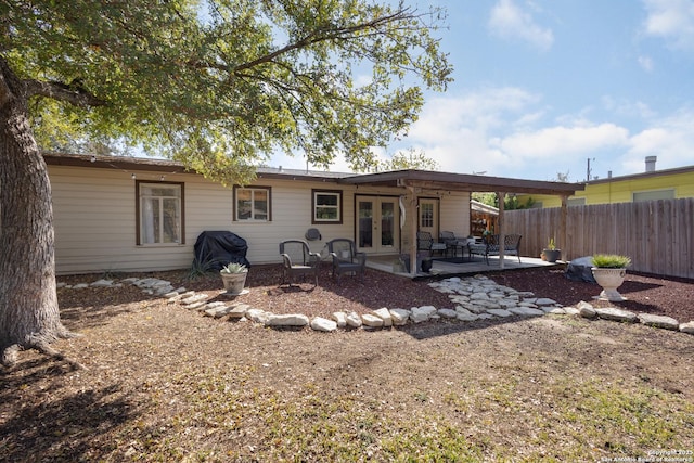 back of house with a patio and french doors