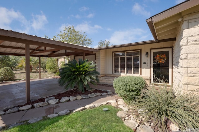 exterior space featuring a carport