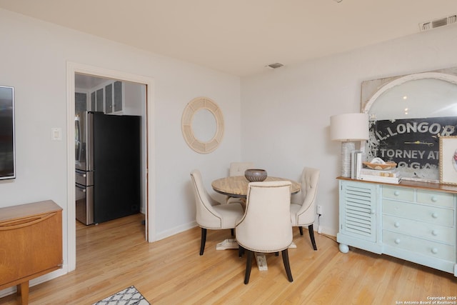 dining room featuring light hardwood / wood-style flooring