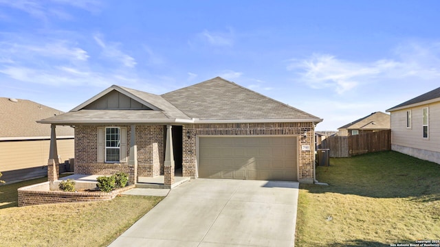 view of front of house featuring a garage and a front lawn