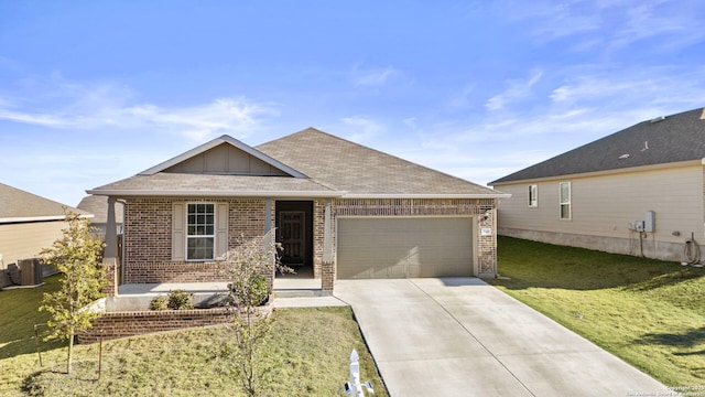 view of front of house featuring a front yard and a garage