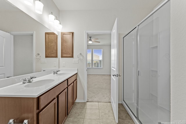 bathroom with ceiling fan, tile patterned floors, walk in shower, and vanity