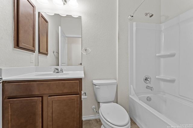 full bathroom featuring washtub / shower combination, vanity, and toilet