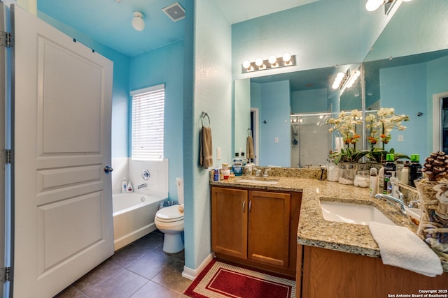 full bathroom with tile patterned flooring, vanity, toilet, and independent shower and bath