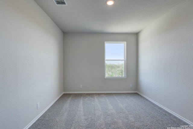 view of carpeted spare room