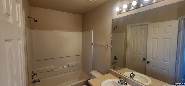 full bathroom featuring bathing tub / shower combination, vanity, and toilet