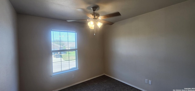 carpeted empty room featuring ceiling fan