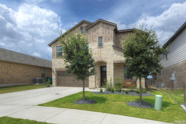 view of front of property featuring a front lawn, a garage, and central AC unit