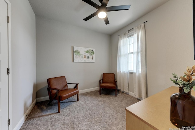 living area featuring ceiling fan and light colored carpet