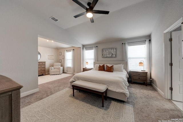 carpeted bedroom featuring ceiling fan, lofted ceiling, and multiple windows