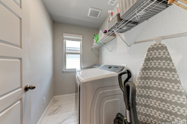 laundry room with independent washer and dryer