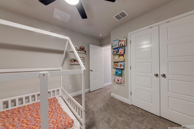 unfurnished bedroom featuring carpet floors, a closet, and ceiling fan