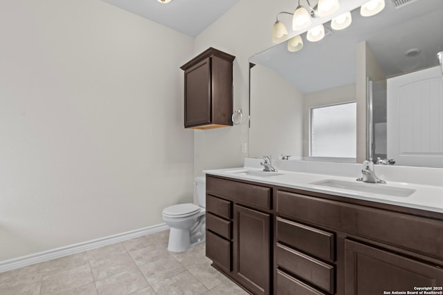 bathroom with tile patterned floors, vanity, and toilet