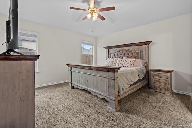 carpeted bedroom with multiple windows and ceiling fan