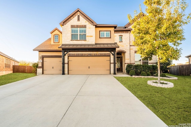 view of front of property featuring a front yard and a garage