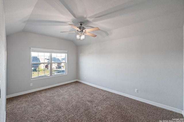 unfurnished room with carpet flooring, ceiling fan, and vaulted ceiling