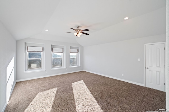 interior space featuring ceiling fan and vaulted ceiling