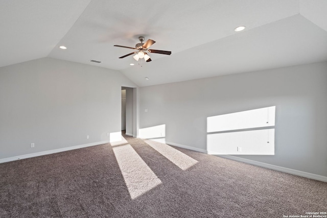 spare room featuring carpet floors, ceiling fan, and lofted ceiling