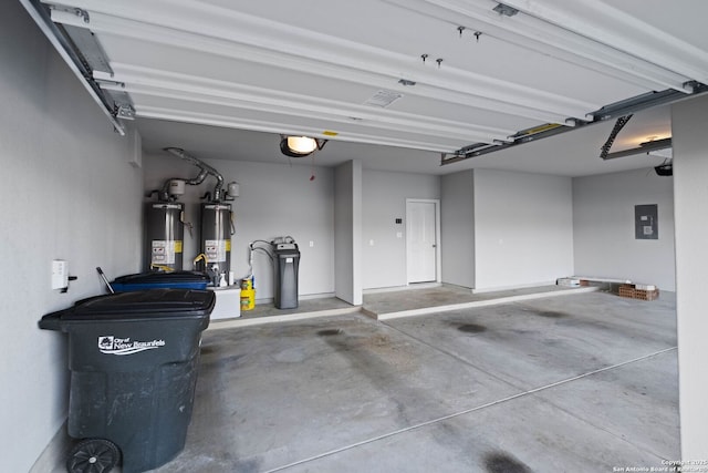 garage featuring electric panel, a garage door opener, and gas water heater