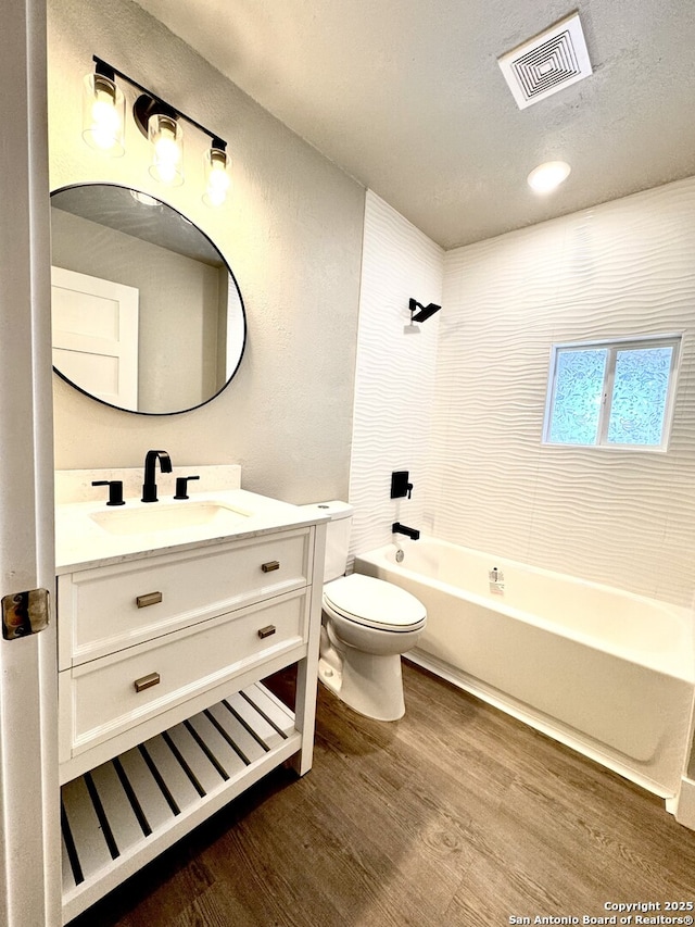 full bathroom featuring shower / bathing tub combination, vanity, toilet, and wood-type flooring