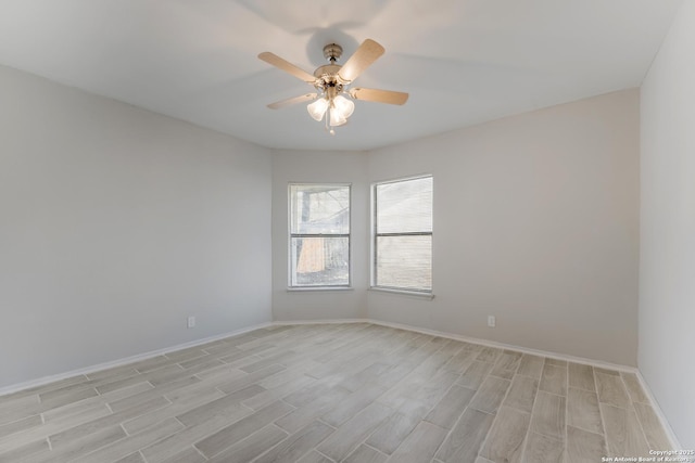 unfurnished room featuring light hardwood / wood-style flooring and ceiling fan