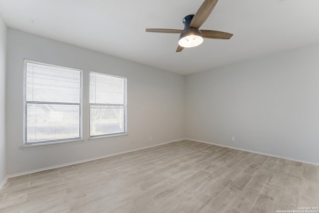 unfurnished room featuring ceiling fan and light wood-type flooring