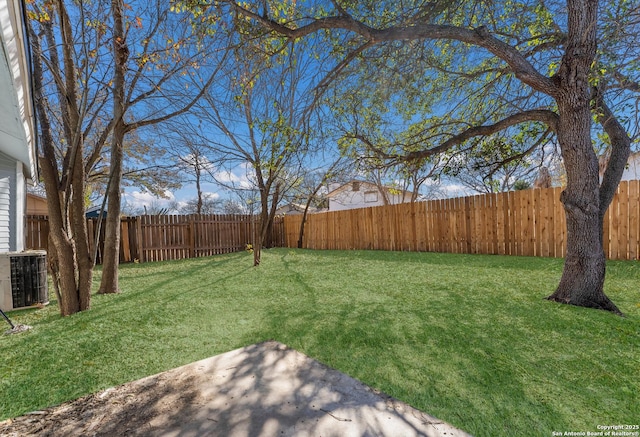 view of yard featuring central AC unit