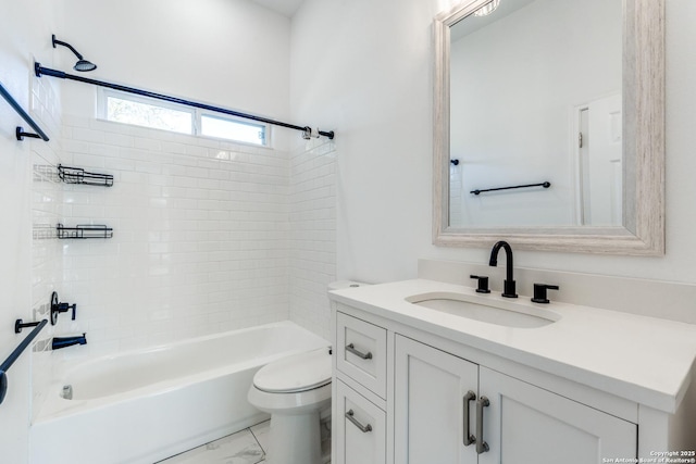 full bathroom with vanity, toilet, and tiled shower / bath